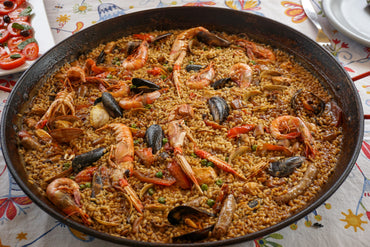 Traditional Spanish paella steaming with fresh ingredients