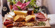 Tablas Gourmet Puerto de Oriente: El Arte del Aperitivo Mediterráneo Perfecto